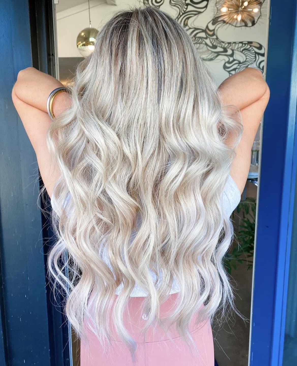 Icy platinum blonde curls, from behind