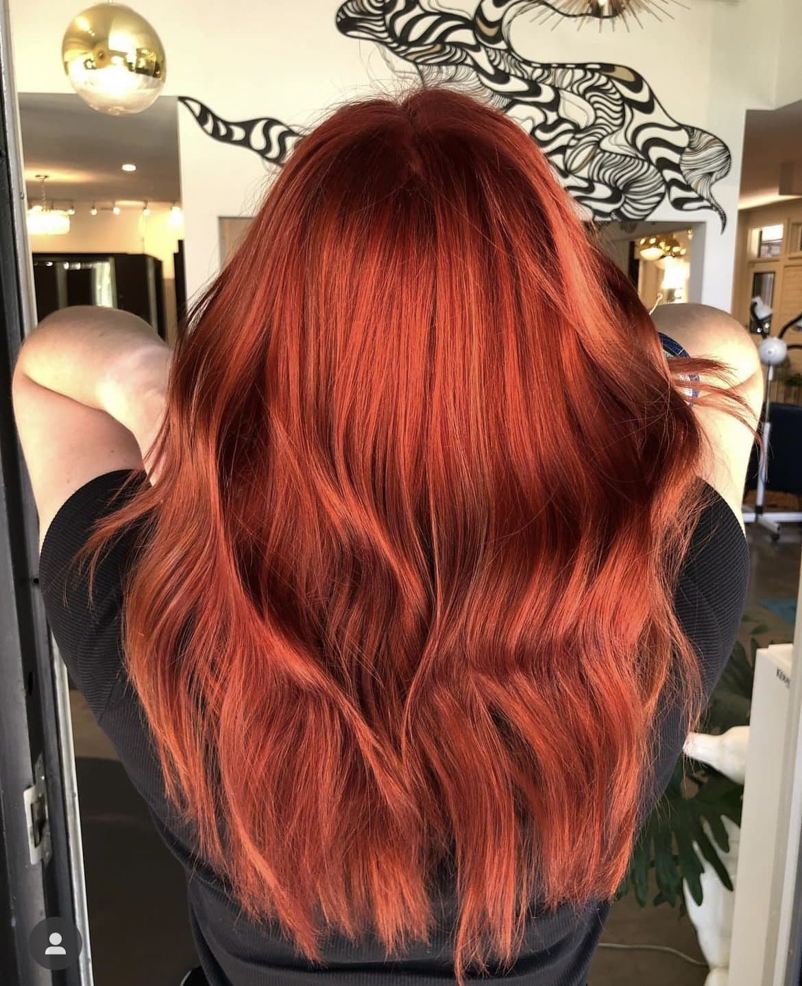 Vivid copper-red hair, smooth with a soft bend, from behind